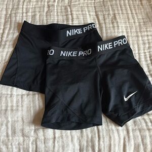 two pair girls small nike pros
